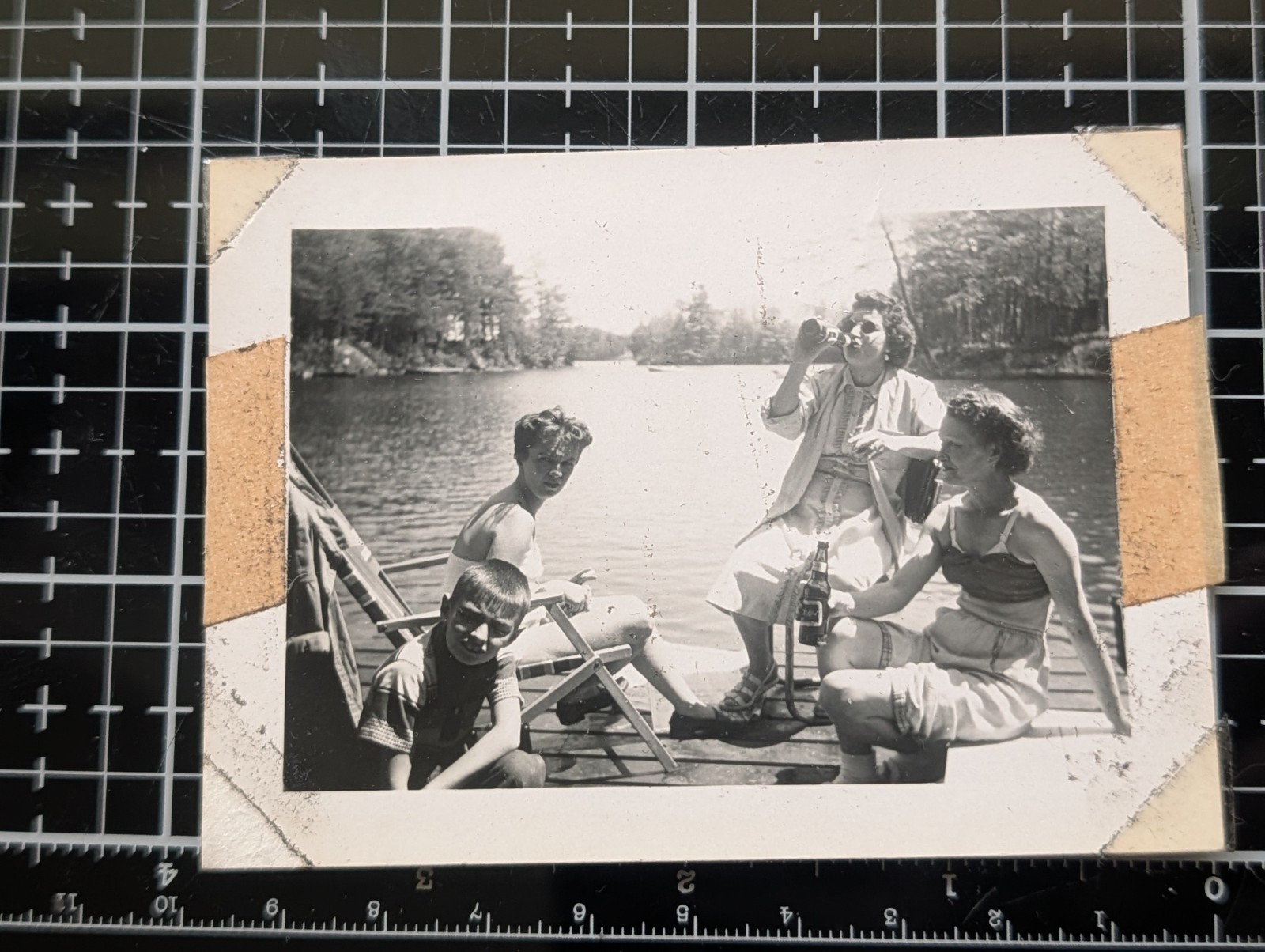 Get together at the river women drinking antique black and white photo
