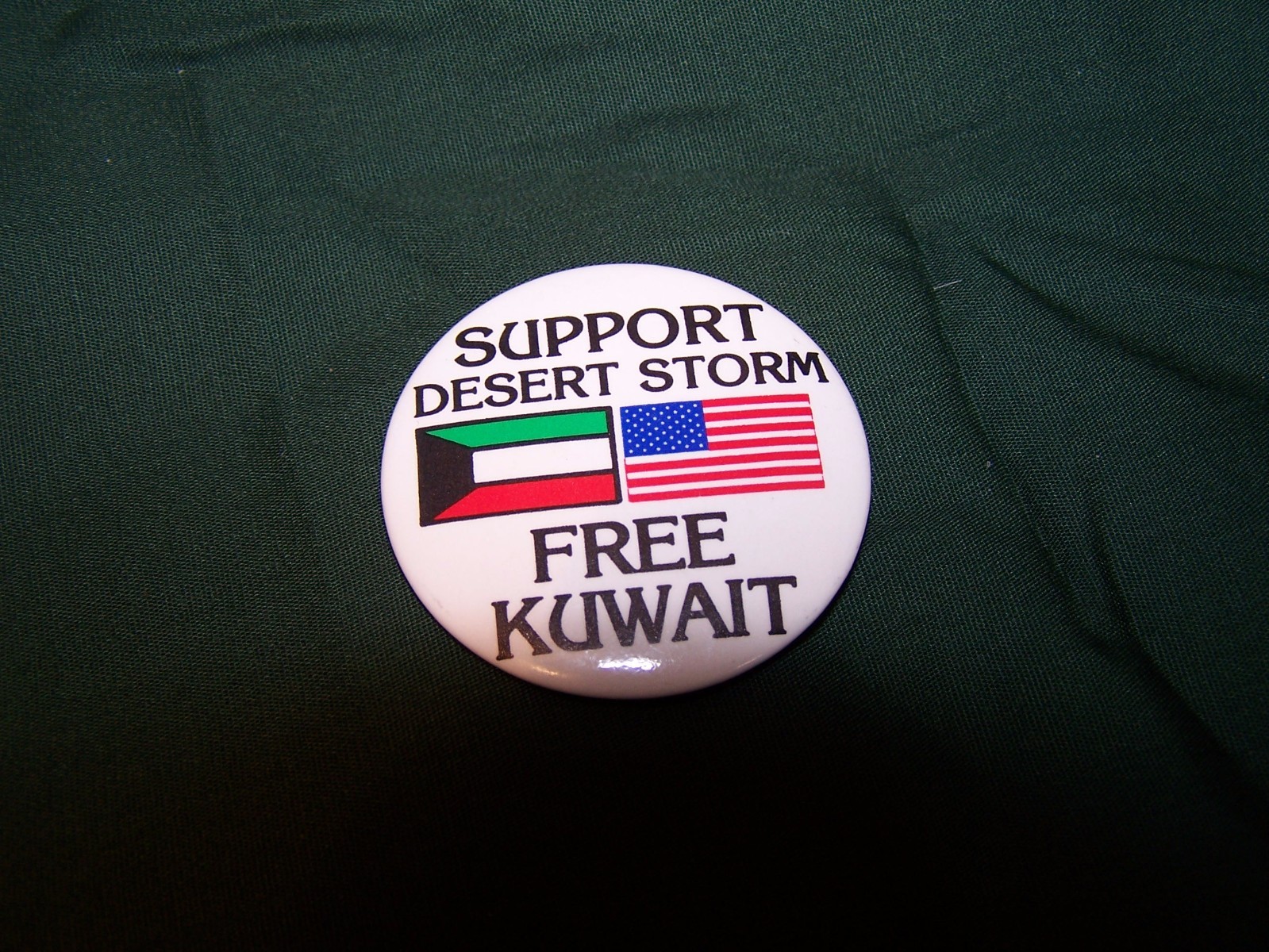 “Free Kuwait, Support Desert Storm” cello pin-back button, 1991.