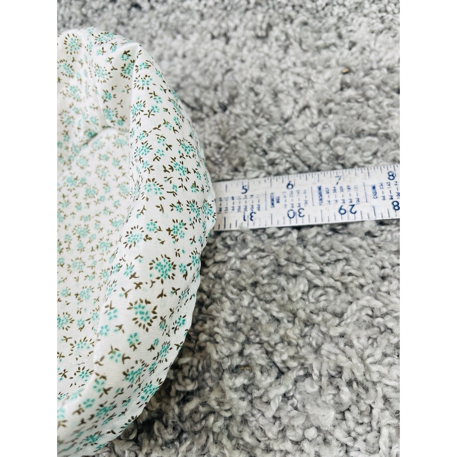 Small Wicker Basket With a Removable Cloth Liner Featuring a Teal Floral Pattern