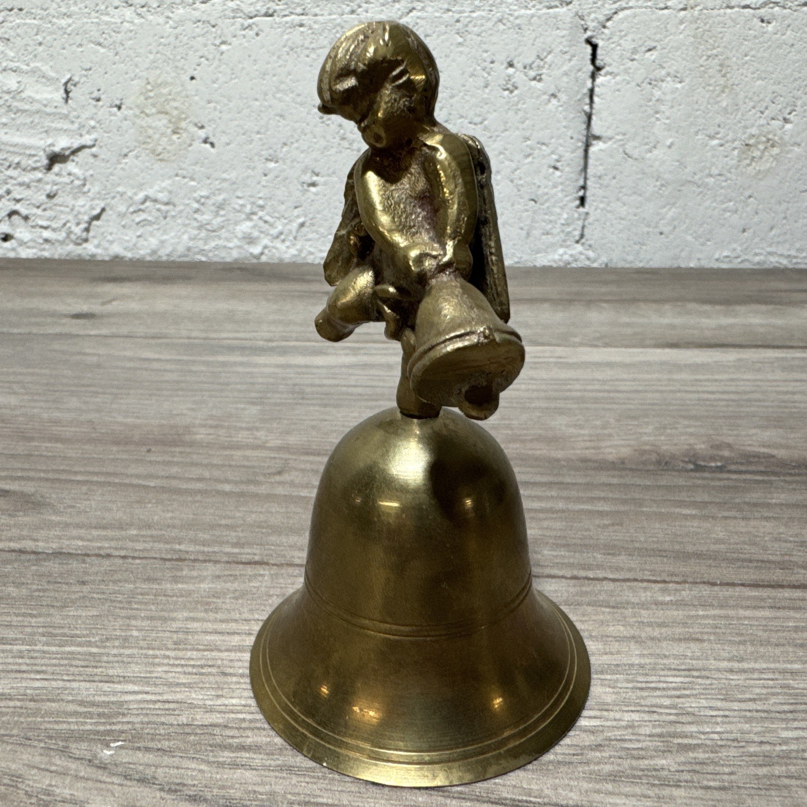 Vtg Brass cherub angel bell 5.75”tall Swinging A Bell Made In India