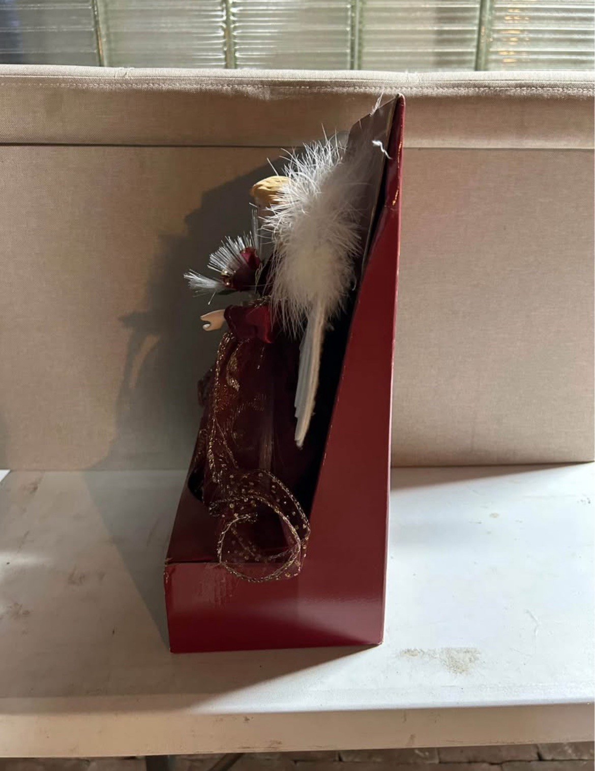 This is a lighted fiber optic angel Christmas tree topper. 12-inch tree topper