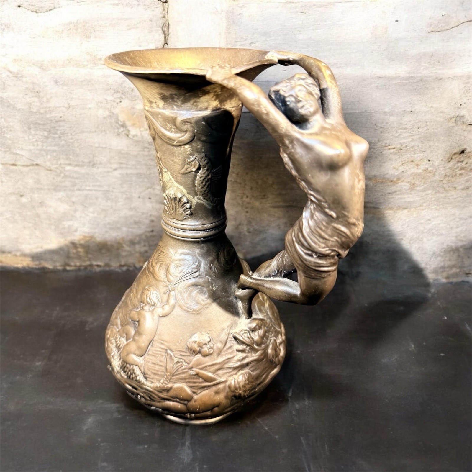 Bronze-finished metal ewer with figural female handle in Art Nouveau style,