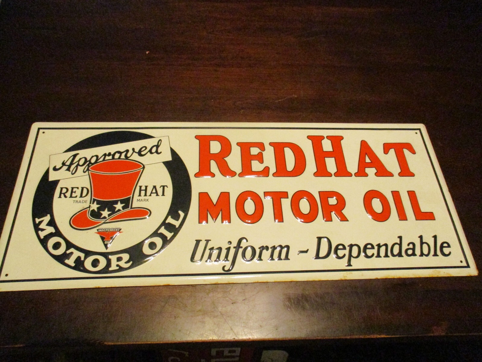 APPROVED RED HAT MOTOR OIL UNIFORM-DEPENDABLE EMBOSSED METAL SIGN 23 1/2X 9 3/4′