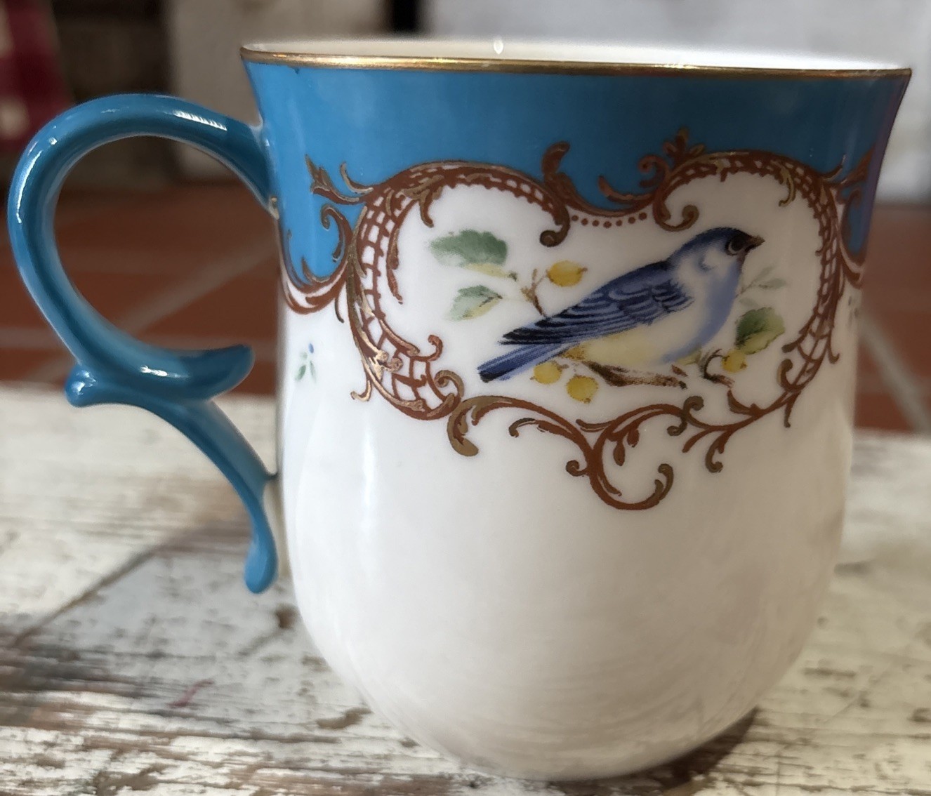 A Gracie Bone China mug with a blue bird and gold trim. NO CHIPS.