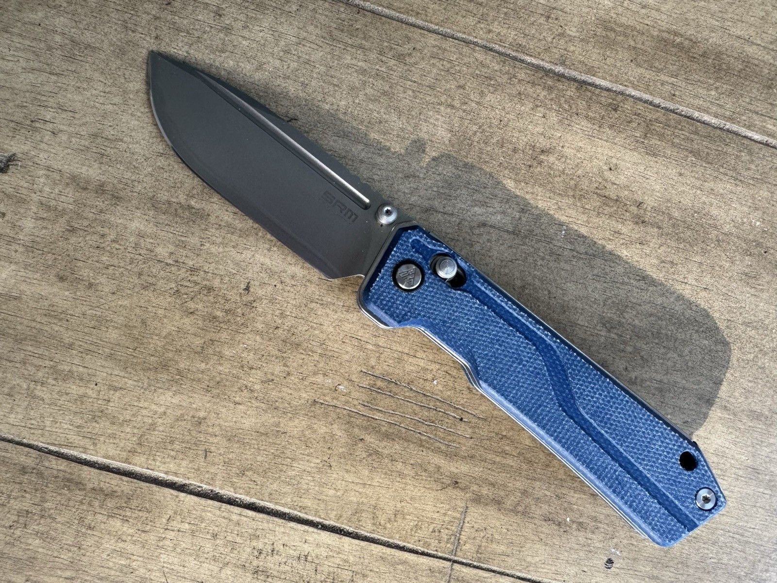 SRM Rubik 3.43″ Laminated 140Cr blade, blue Micarta 25 % off list, Lanyard incl