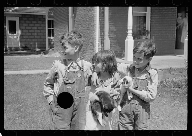 Photo:1930s Three Children Holding Kittens Farmhouse Porch Lawn