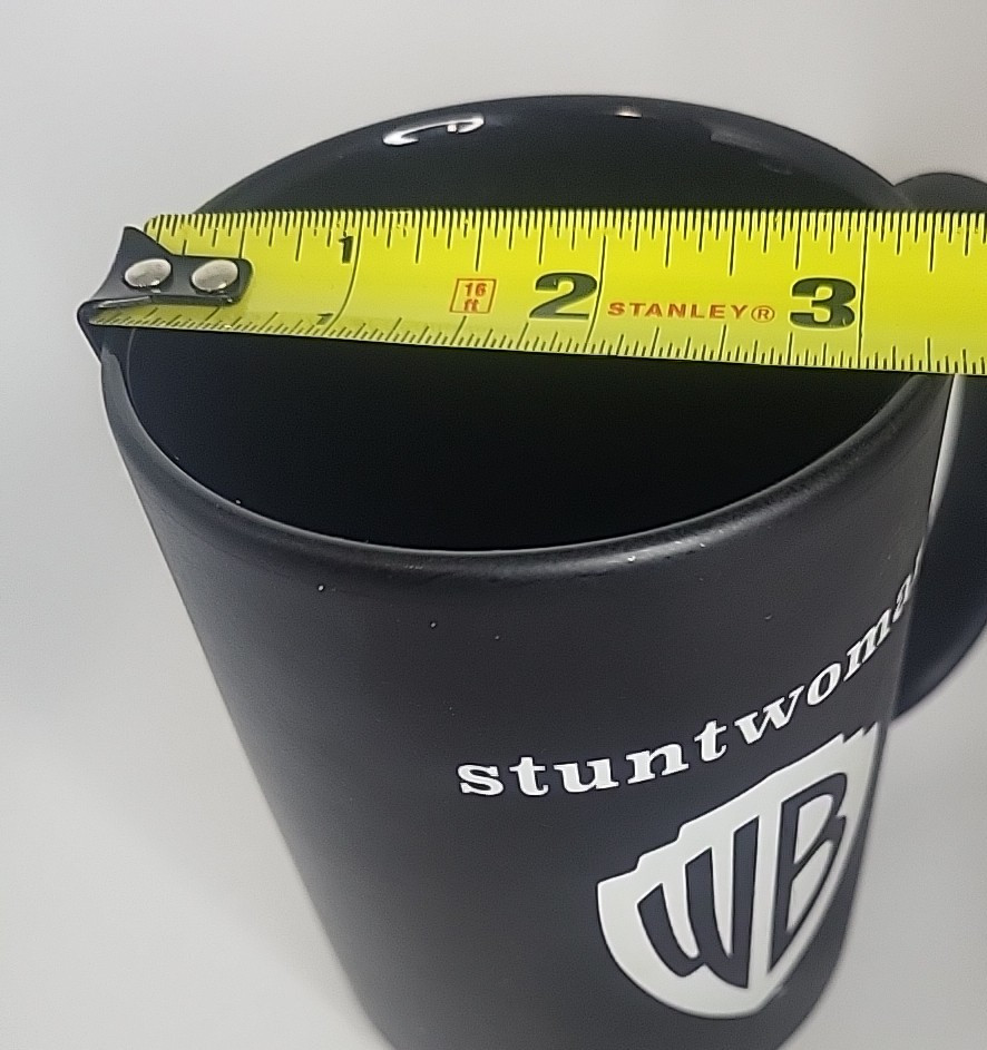 Warner Bros Studio Coffee Mug WB Shield Stuntwoman Black Matte Finish 16 ox