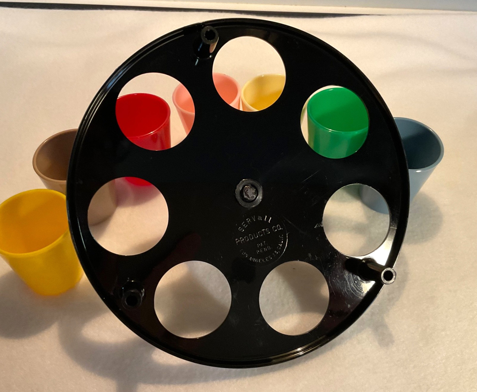 7 Plastic Multicolored Shot Glasses w/Black Carrier/Caddy. RARE SERVall Products