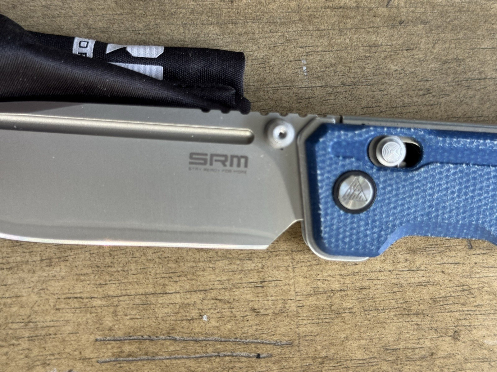 SRM Rubik 3.43″ Laminated 140Cr blade, blue Micarta 25 % off list, Lanyard incl