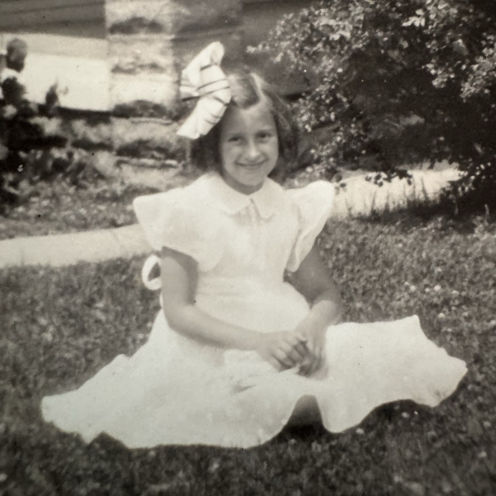 Vintage Old Candid Snapshot Photo Portrait Young Girl Seated w/bow, bag in Dress