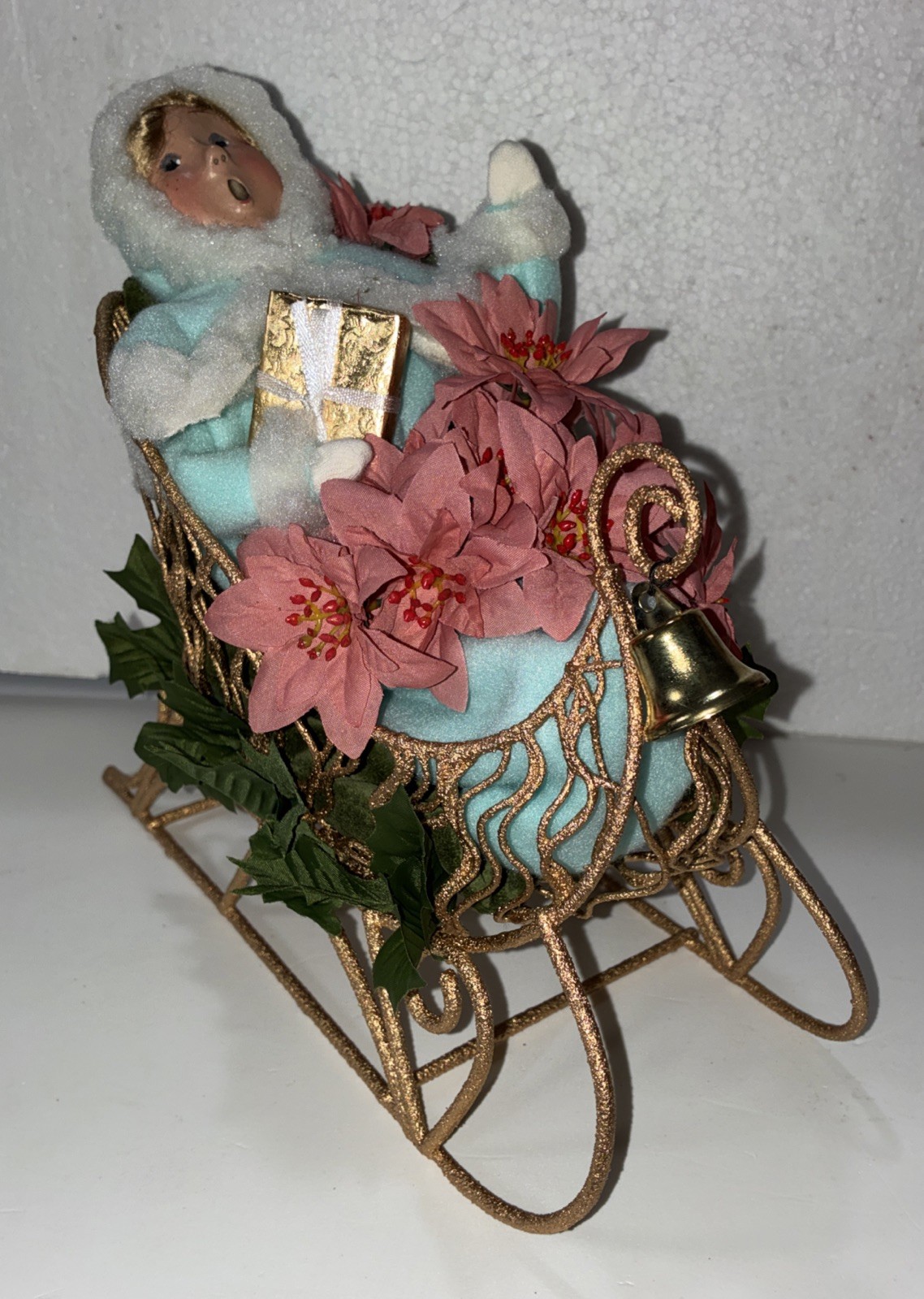 Buyers Choice Singing Girl in Sleigh with Gift, Bell And Poinsettias, 10.5” X 9”