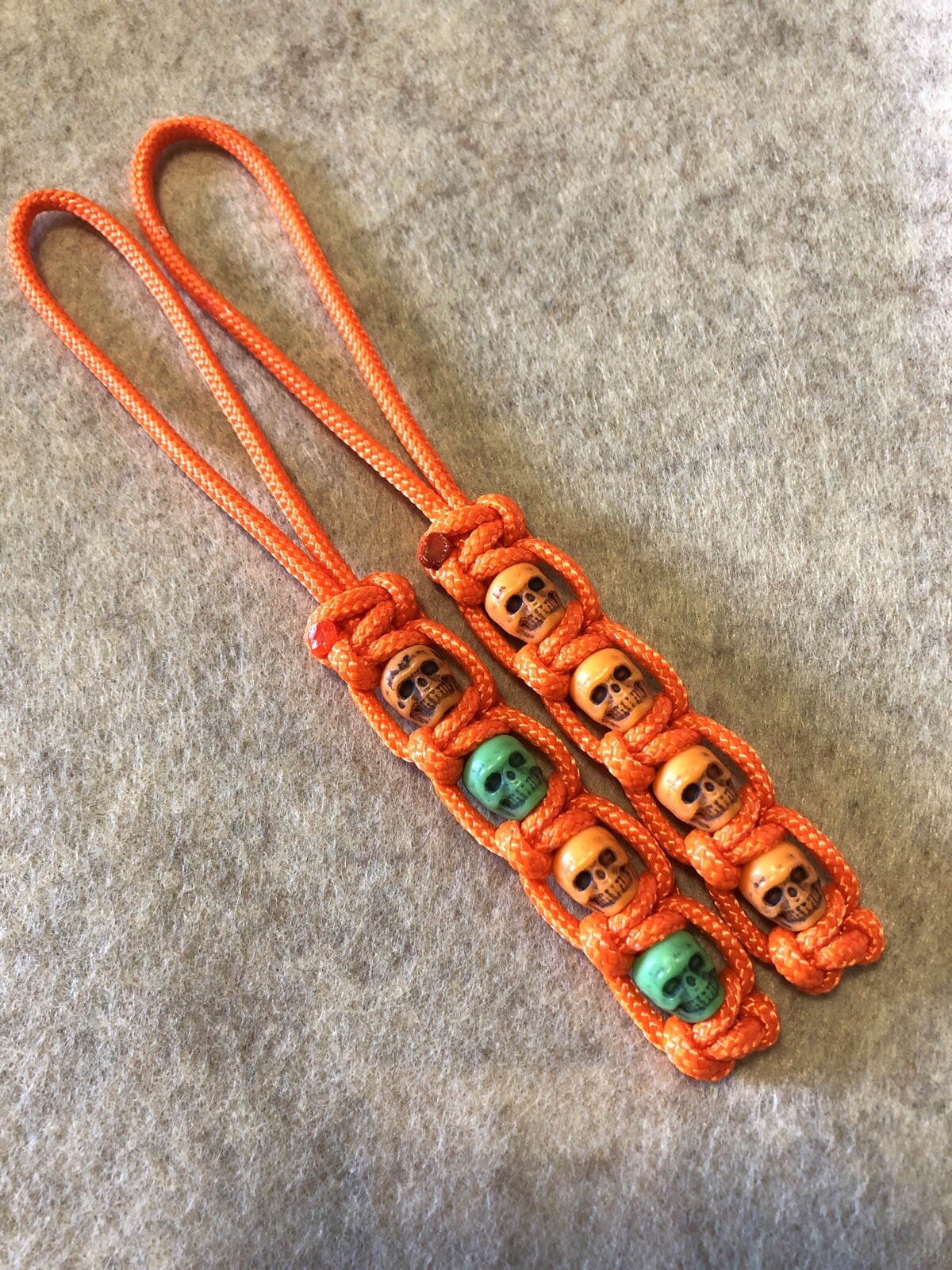 325 Paracord Small Hole Knife Lanyard 2pk Orange With Orange And Green Skulls