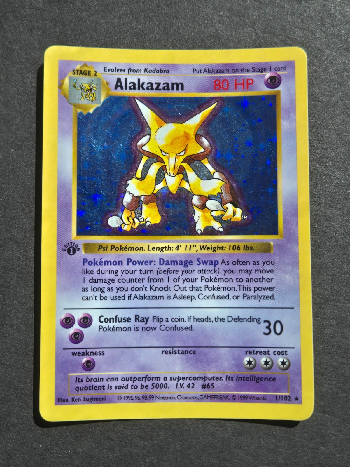 Pokemon 1ST EDITION ALAKAZAM 1/102 – 1999 BASE SET SHADOWLESS HOLO RARE – LP/MP