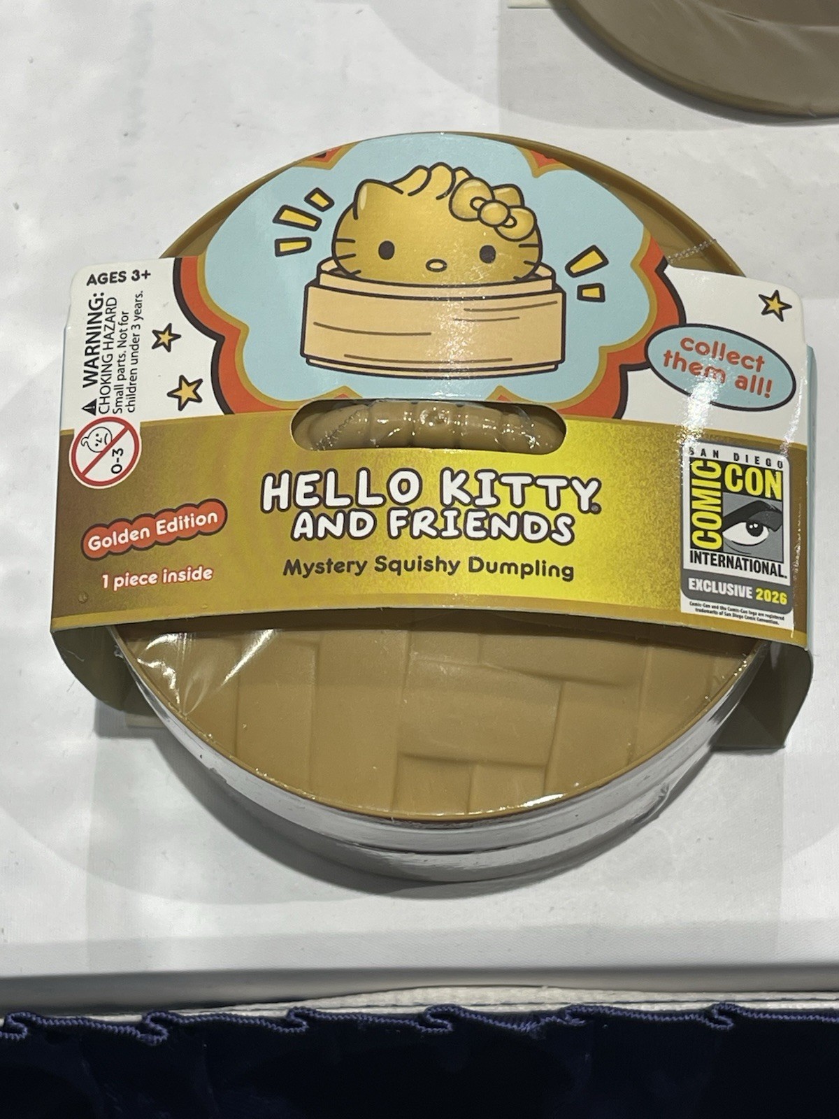 SDCC 2026 UCC Exclusive Hello Kitty “Golden Glitter” Squishy Dumpling In Hand