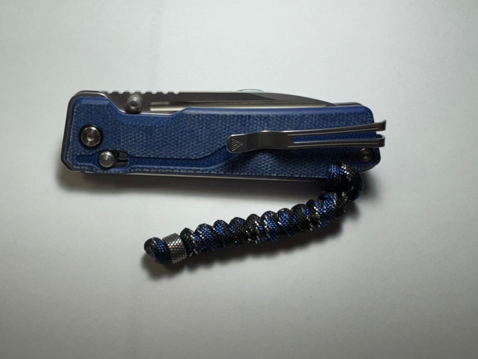 SRM Rubik 3.43″ Laminated 140Cr blade, blue Micarta 25 % off list, Lanyard incl