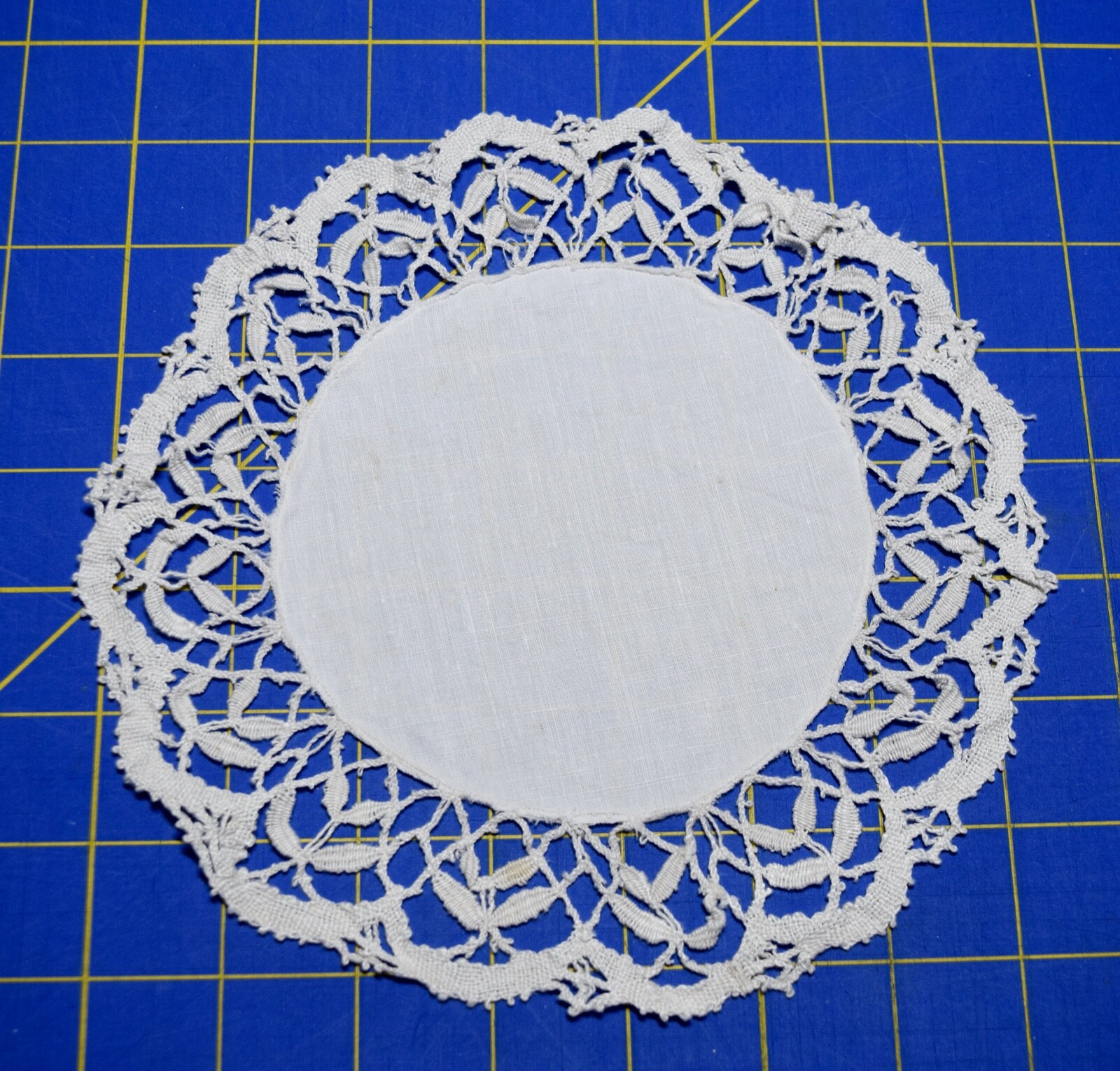 3924 Antique hand worked white needle lace doily, linen center, 10 inches