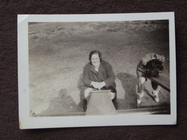 WOMAN AT BOTTOM OF A SEE SAW WITH CAMERA PERSON UP TOP 1930’s PHOTO