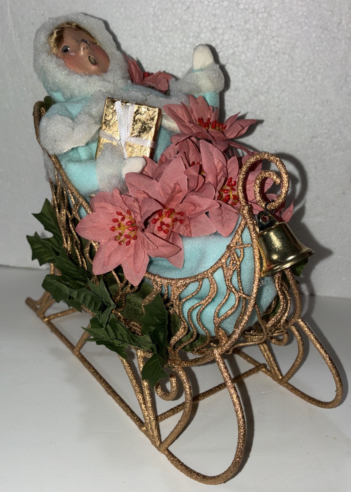 Buyers Choice Singing Girl in Sleigh with Gift, Bell And Poinsettias, 10.5” X 9”