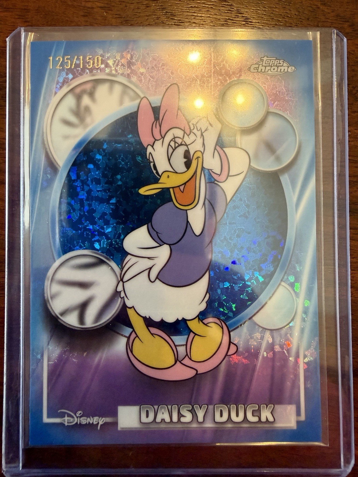 2026 Topps Chrome Disney Daisy Duck Blue Cracked Ice Refractor 125/150