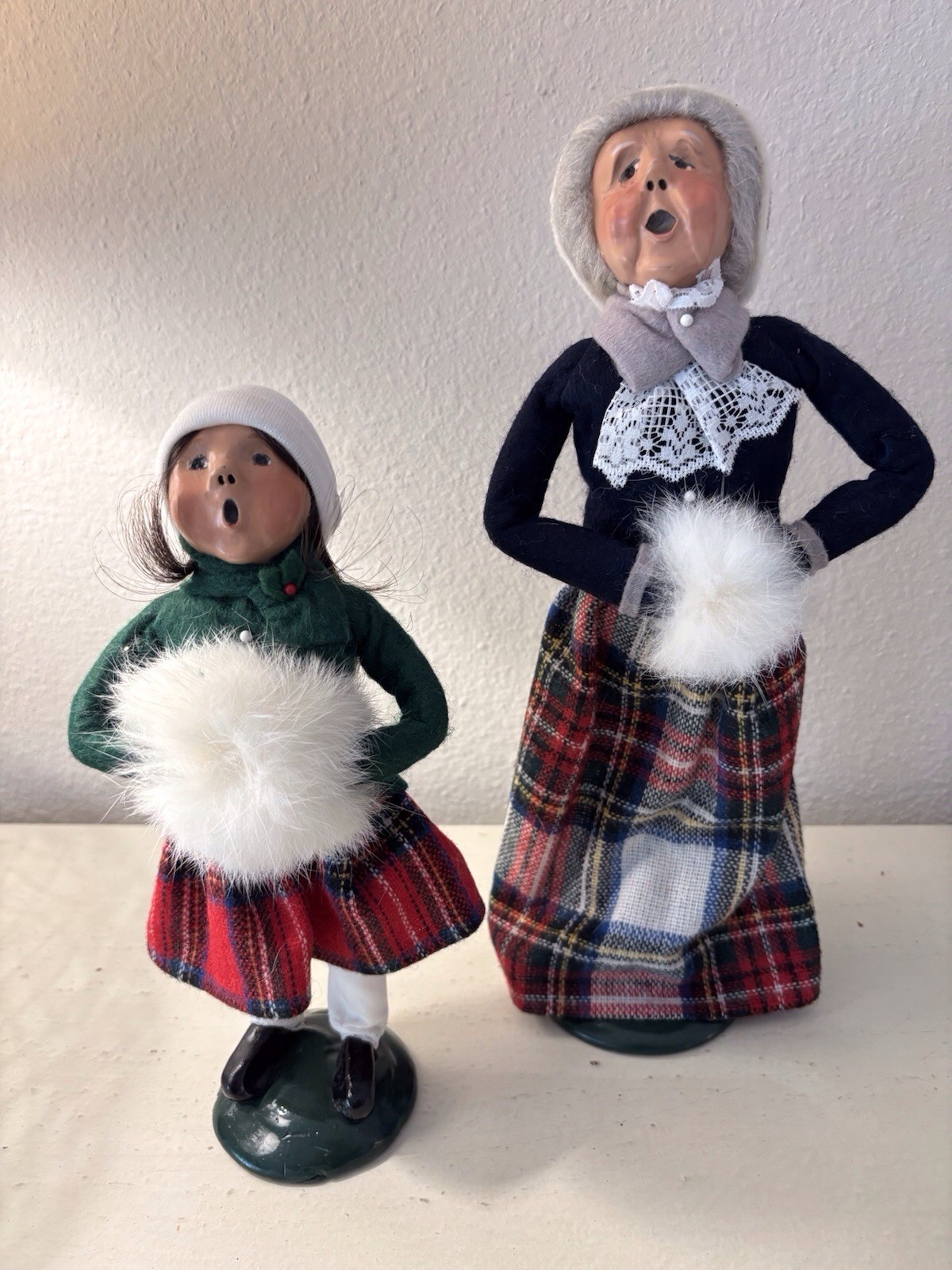 Byers Carolers. Grandmother And Granddaughter In Tartan With White Muffs