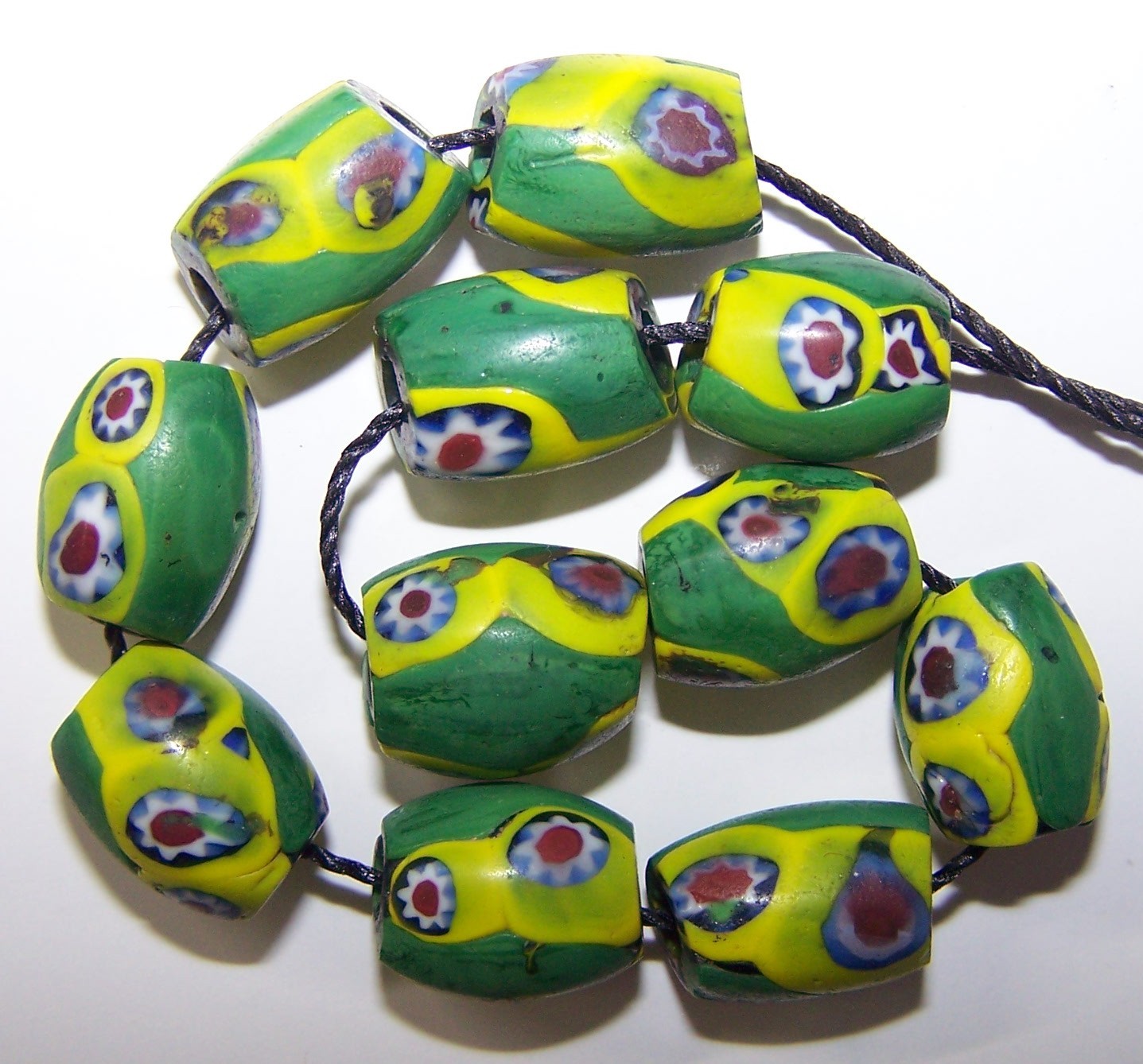 Antique Venetian Trade Beads – 11 Green Ovals with Yellow/Red Millefiori Eyes