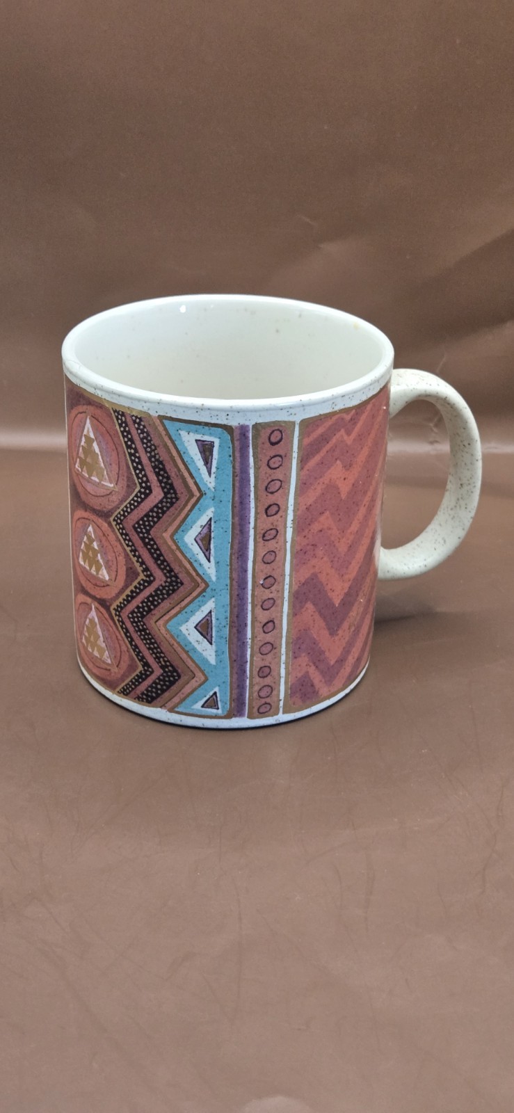 Laurel Burch Mug “Native Rhythm”. Beige w/ Gold Orange Purple . 12 oz