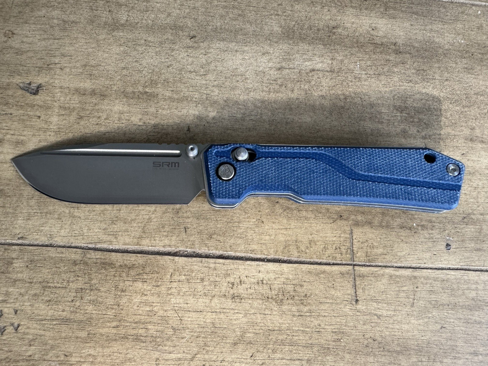 SRM Rubik 3.43″ Laminated 140Cr blade, blue Micarta 25 % off list, Lanyard incl