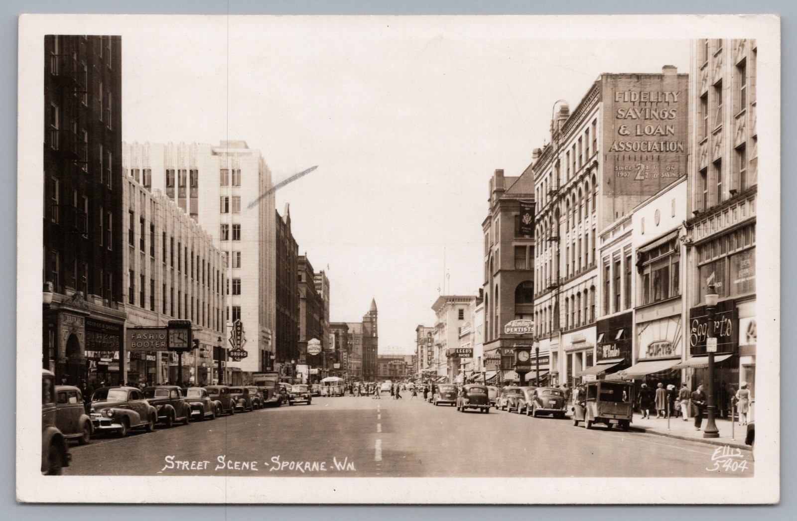 Street Scene Spokane WA Dodson’s Jewelers Joyner Drugs RPPC Ellis 5404 Postcard