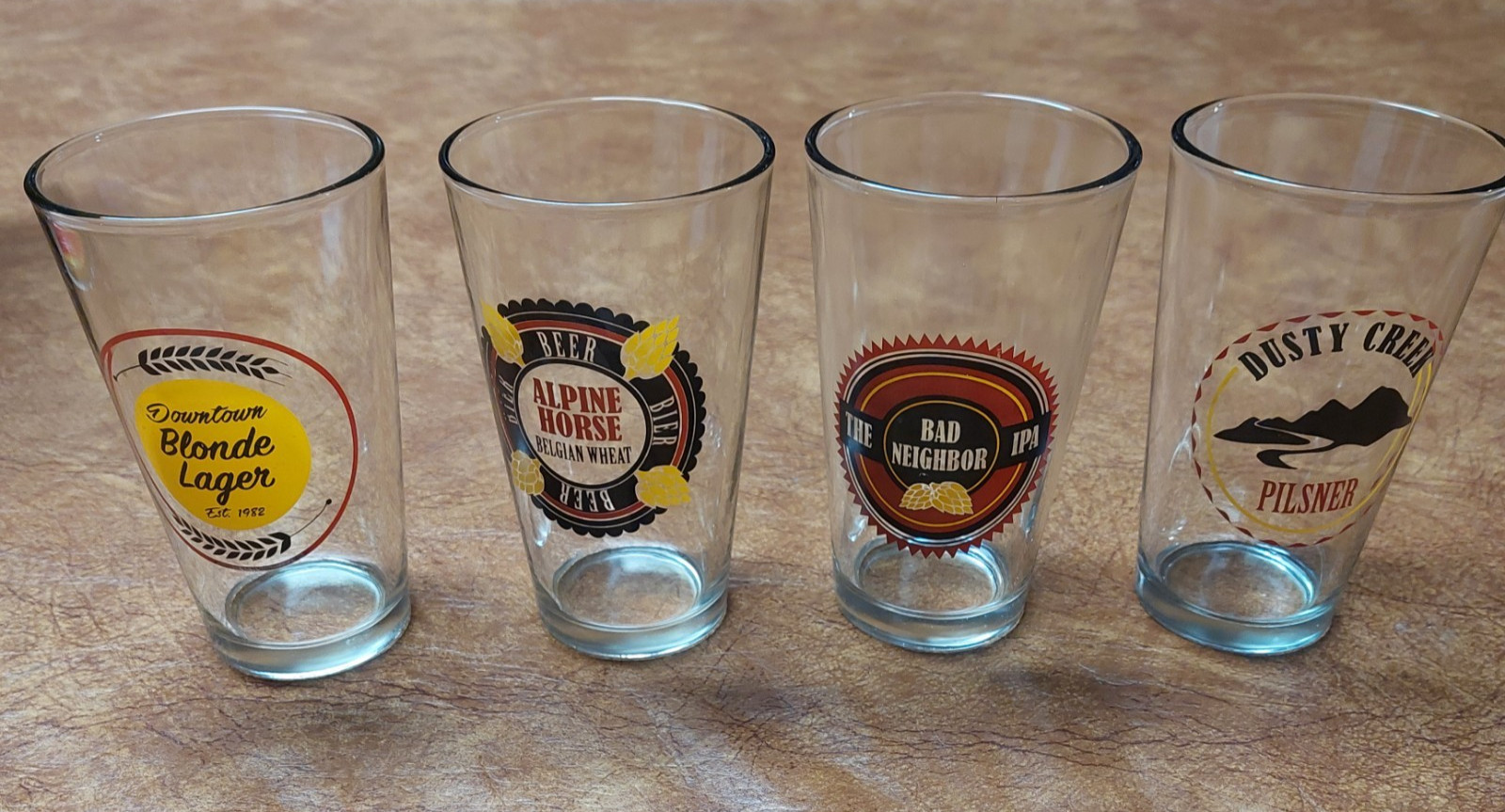 Lot Of 4 Pint Beer Glasses w/Logos