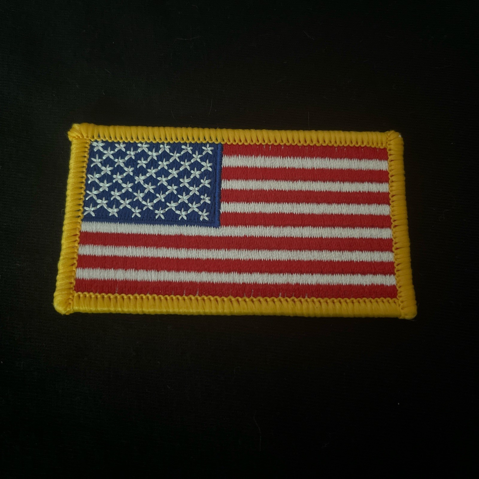 US American Flag Reverse Shoulder Patch Orange Border. MADE IN USA 3 1/4 X 1 7/8