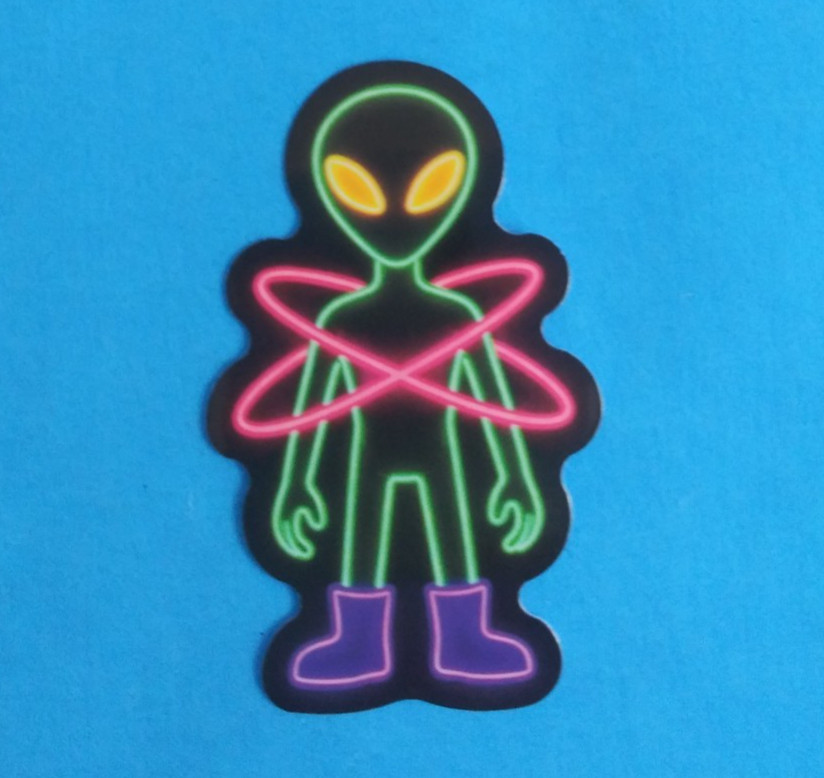 Green Alien With Yellow Eyes Neon Sticker 2.18″ x 1.38″ (X)