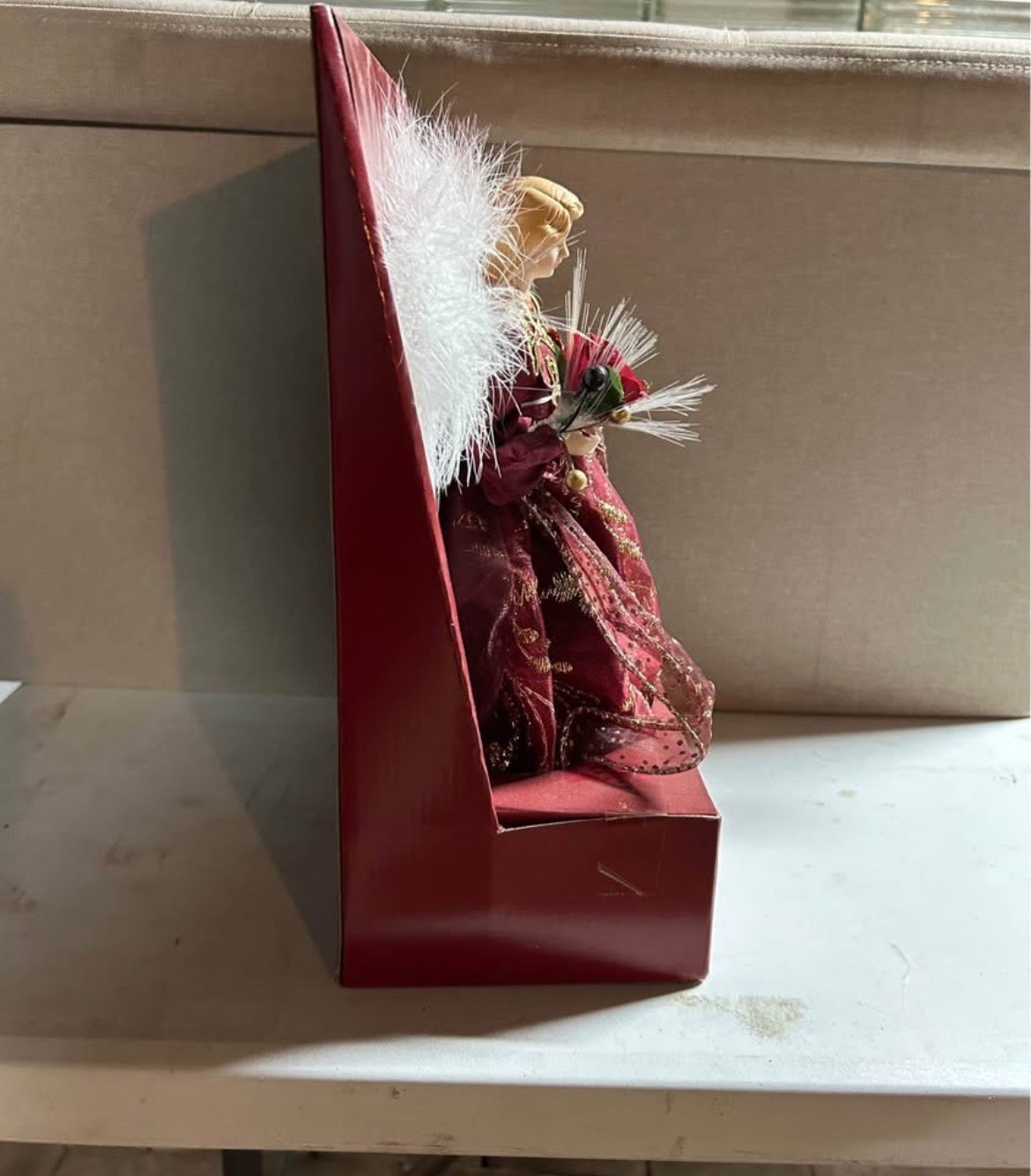 This is a lighted fiber optic angel Christmas tree topper. 12-inch tree topper