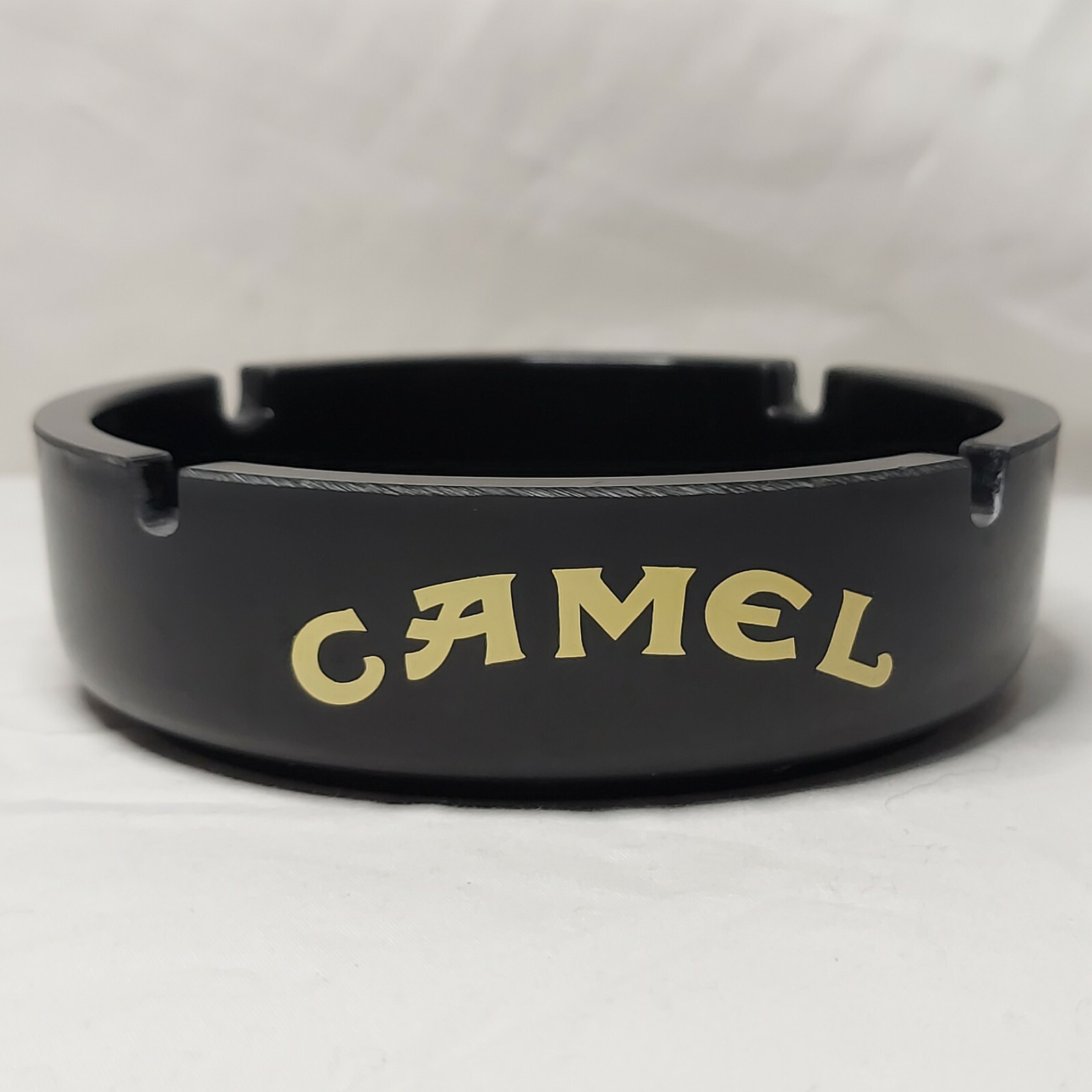 Camel Ashtray 5 3/4″ Round Heavy Plastic Black w/ Yellow Camel Advertisement