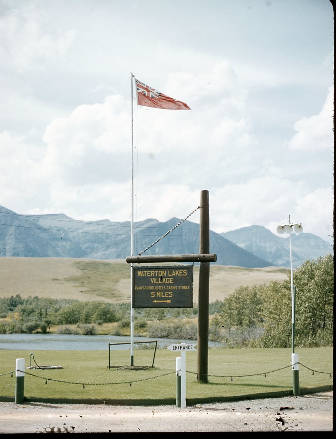 SL28 Slide 1960 Waterton Lakes Village Canada Red Ensign Flag Mountains 809a