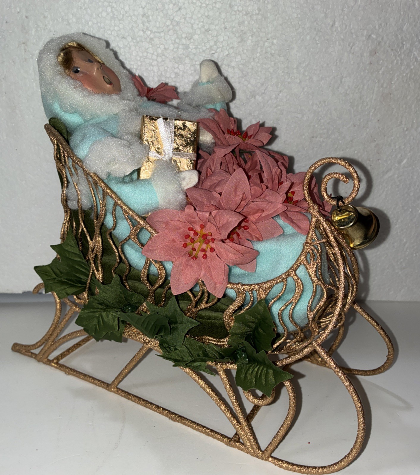Buyers Choice Singing Girl in Sleigh with Gift, Bell And Poinsettias, 10.5” X 9”