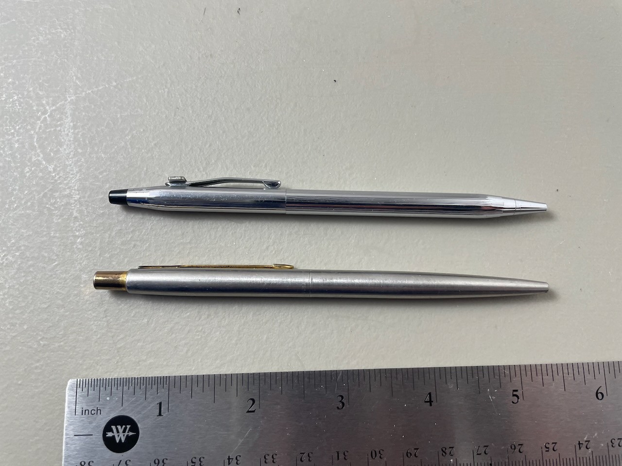 Cross Ballpoint (silver, w/ ISI logo) and Parker Jotter (brushed metal) working
