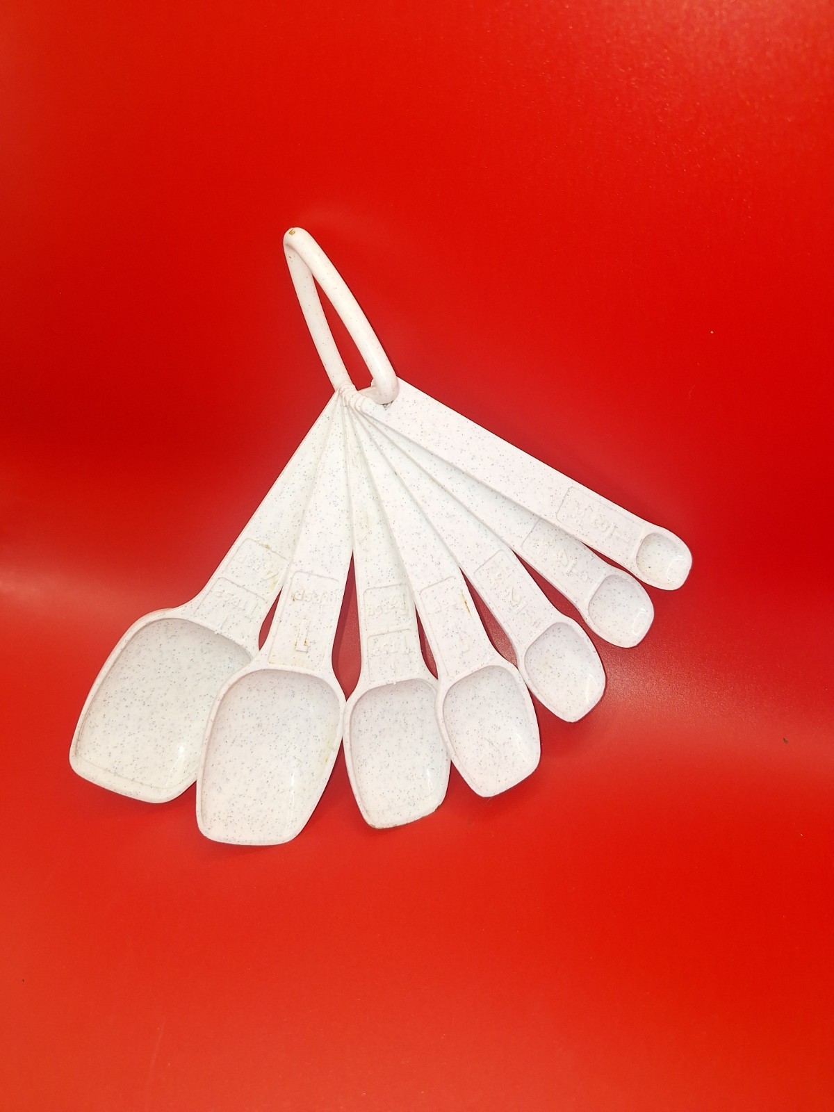 TUPPERWARE Vintage ivory white nesting measuring spoons complete set of 7