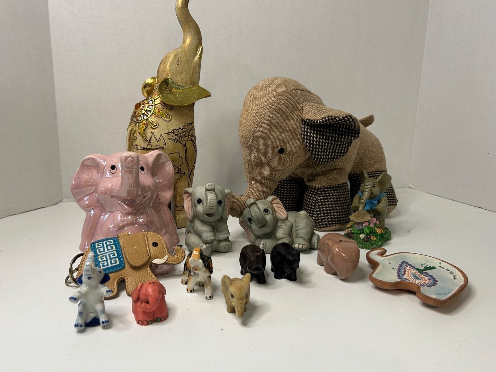 Elephant Collector’s Lot of 15 – Mixed Media Figurines, Trinket Dish, Bank, & Ke